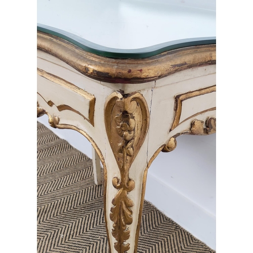 189 - OCCASIONAL TABLE, 19th century and later Italian with a shaped mirrored top on a cream and gilt pain... 