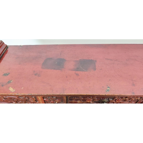 184 - ALTAR TABLE, Chinese red lacquer with carved detail and three drawers, 29cm D x 110cm H x 158cm W.