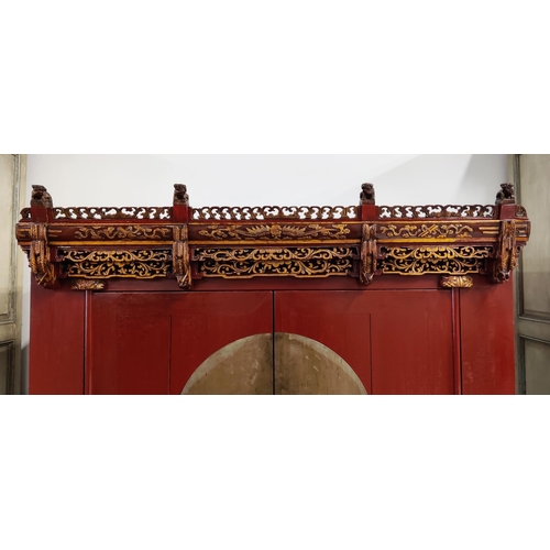 185 - CHINESE MARRIAGE CABINET, 101cm x 70cm D x 180cm H, red lacquer with carved and gilded fretwork deta... 