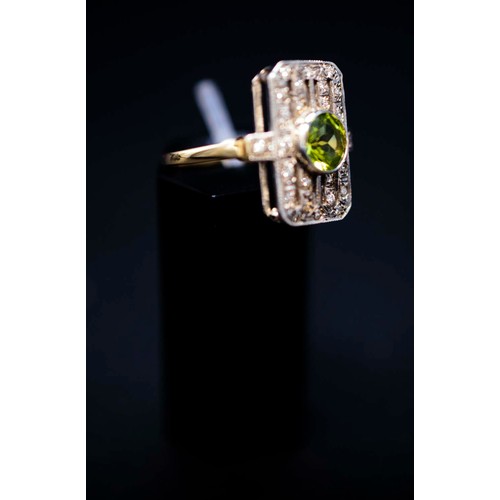 47 - ART DECO STYLE PERIDOT AND DIAMOND SET COCKTAIL RING, the peridot of approximately 0.85 carats, surr... 