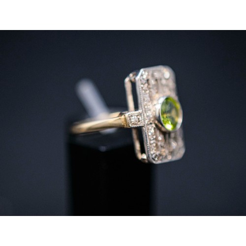 47 - ART DECO STYLE PERIDOT AND DIAMOND SET COCKTAIL RING, the peridot of approximately 0.85 carats, surr... 