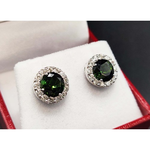 36 - 18CT WHITE GOLD TOURMALINE AND DIAMOND STUD EARRINGS, a pair, each set with a mixed cut tourmaline a... 