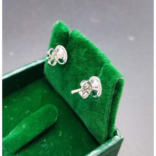 42 - EMERALD AND DIAMOND STUD EARRINGS, a pair, each with a central emerald cut emeralds surrounded by 14... 