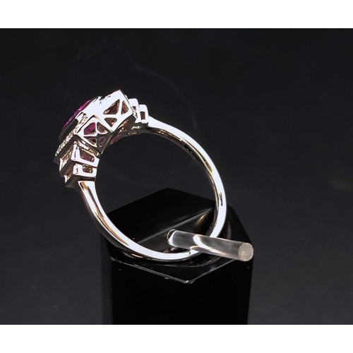 59 - ART DECO STYLE PLATINUM PINK SAPPHIRE AND DIAMOND DRESS RING, the step cut central sapphire surround... 