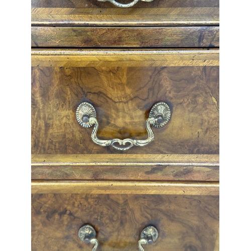 167 - BEDSIDE CHESTS, a pair, George III design burr walnut and crossbanded each with four graduated drawe... 