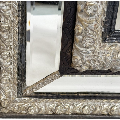 262 - DUTCH WALL MIRROR, 19th century rectangular ebony and repoussé silvered metal, with cushion shaped m... 