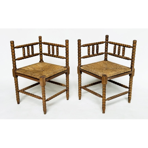 165 - CORNER CHAIRS, a pair, late 19th century oak bobbin turned with rush seats, 59cm W. (2)