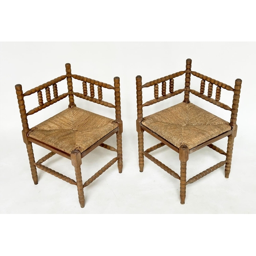 165 - CORNER CHAIRS, a pair, late 19th century oak bobbin turned with rush seats, 59cm W. (2)