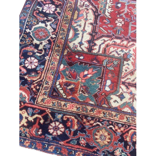 116 - ANTIQUE PERSIAN HERIZ CARPET, 310cm x 230cm.