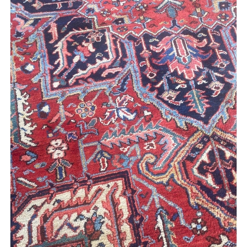 116 - ANTIQUE PERSIAN HERIZ CARPET, 310cm x 230cm.