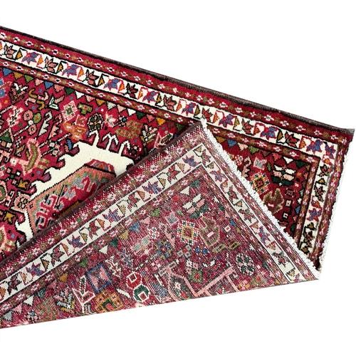 119 - FINE MID 20th CENTURY PERSIAN HERIZ KARAJA RUNNER, 337cm x 85cm.