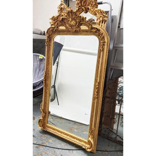 395 - OVERMANTEL WALL MIRROR, ornate gilt frame with bevelled plate, 159cm H x 85cm W.