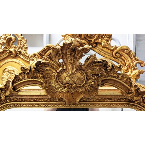 395 - OVERMANTEL WALL MIRROR, ornate gilt frame with bevelled plate, 159cm H x 85cm W.