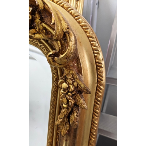 395 - OVERMANTEL WALL MIRROR, ornate gilt frame with bevelled plate, 159cm H x 85cm W.