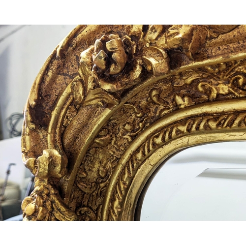 395 - OVERMANTEL WALL MIRROR, ornate gilt frame with bevelled plate, 159cm H x 85cm W.