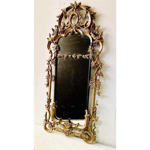 424 - WALL MIRROR, Chippendale Rococo style with scrolling gilt metal frame, 155cm x 72cm.