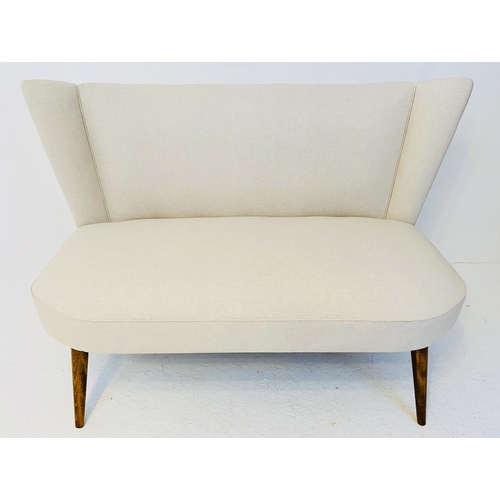 426 - SOFA, 1950s style with neutral linen upholstery on tapered supports, 83cm x 125cm.