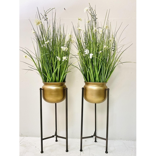 431 - FAUX FLOWERS, a pair, in gilt metal planters on stands, 120cm x 30cm x 30cm. (2)