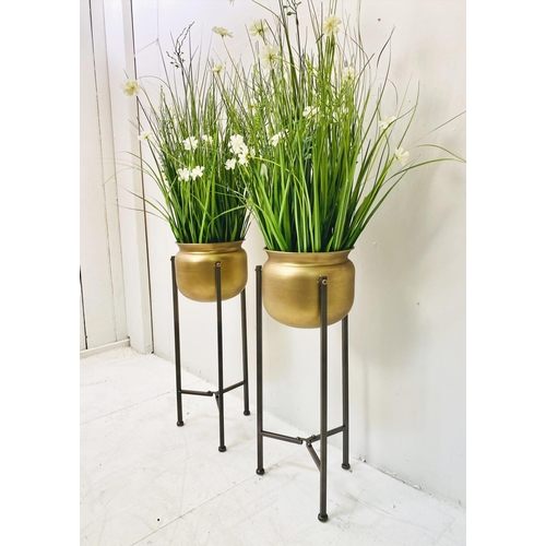 431 - FAUX FLOWERS, a pair, in gilt metal planters on stands, 120cm x 30cm x 30cm. (2)