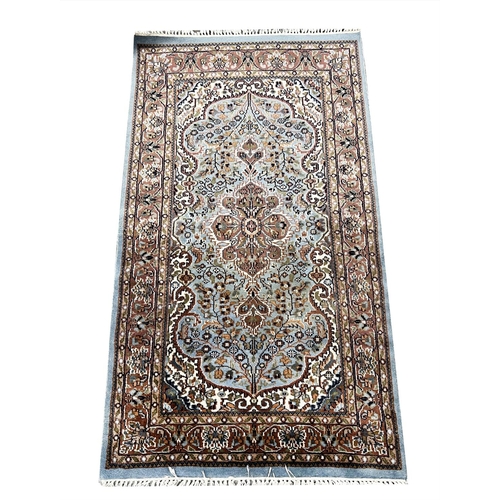 126 - INDIAN TABRIZ DESIGN WOOL AND SILK RUG, 158cm x 91cm.