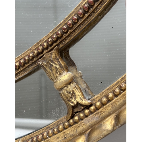 136 - WALL MIRROR, 19th century George III design oval giltwood and gesso with beaded frame and marginal p... 