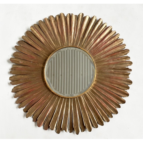 152 - WALL MIRROR, circular bevelled with radiating starburst gilt metal frame, 60cm W.