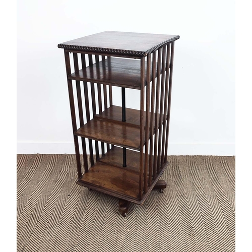 170 - REVOLVING BOOKCASE, Edwardian oak and iron on castors, 106cm H x 51cm x 54cm.