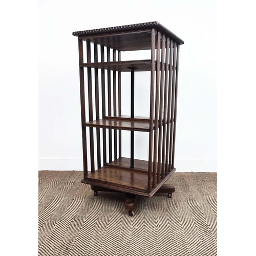 170 - REVOLVING BOOKCASE, Edwardian oak and iron on castors, 106cm H x 51cm x 54cm.