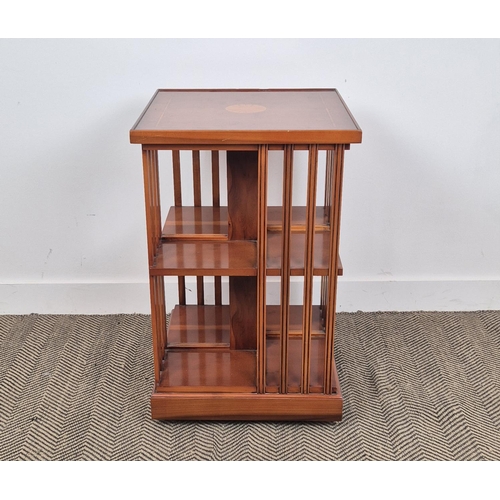 172 - REVOLVING BOOKCASE, yew wood with medallion inlaid top on castors, 78cm H x 50cm x 50cm.