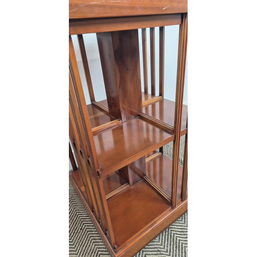 172 - REVOLVING BOOKCASE, yew wood with medallion inlaid top on castors, 78cm H x 50cm x 50cm.