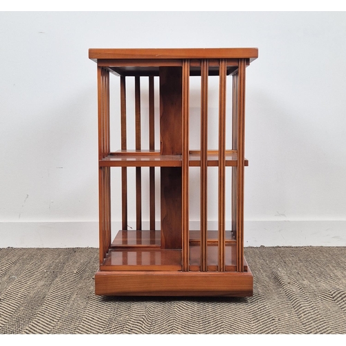 172 - REVOLVING BOOKCASE, yew wood with medallion inlaid top on castors, 78cm H x 50cm x 50cm.