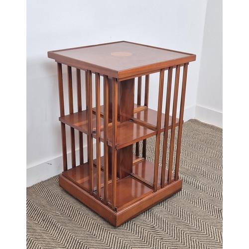 172 - REVOLVING BOOKCASE, yew wood with medallion inlaid top on castors, 78cm H x 50cm x 50cm.