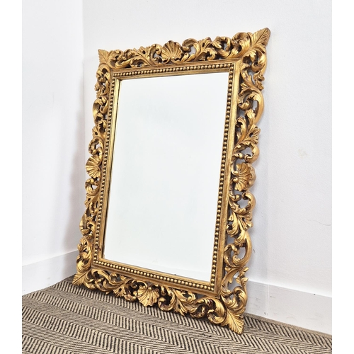 224 - WALL MIRROR, with a decorative gilt frame and a bevelled plate, 77cm x 98cm.