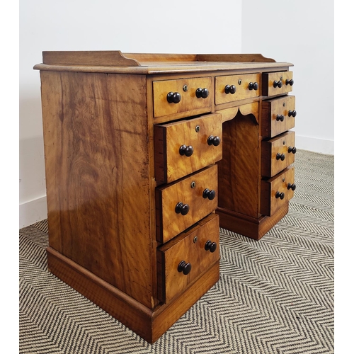 226 - KNEEHOLE DESK, early Victorian birch with a ¾ gallery above nine drawers with ebonised handles, 92cm... 