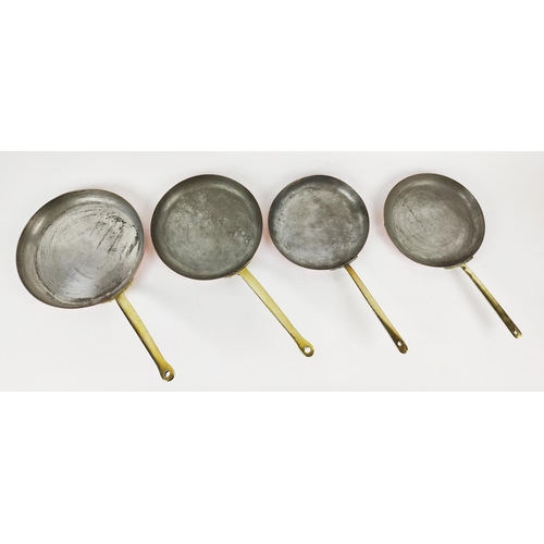 25 - BATTERIE DE CUISINE, four graduated copper frying pans. (4)