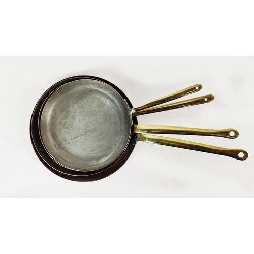 25 - BATTERIE DE CUISINE, four graduated copper frying pans. (4)