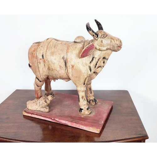 251 - CARVED COW, Indian painted, 48cm H x 30cm x 54cm.