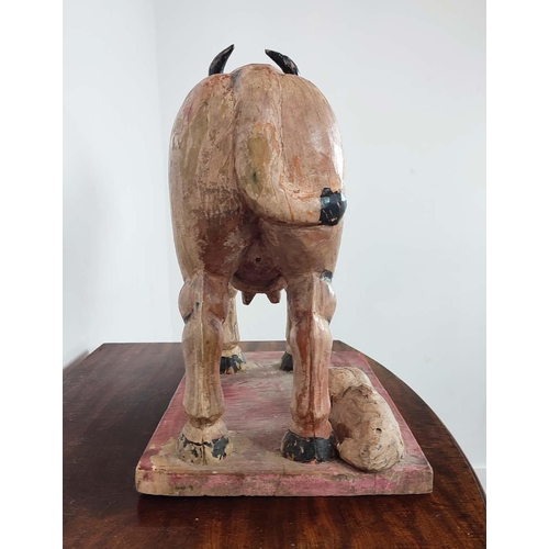 251 - CARVED COW, Indian painted, 48cm H x 30cm x 54cm.