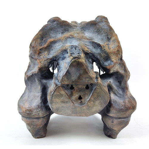 309 - CONTEMPORARY SCHOOL SCULPTURE, of a T Rex skull, painted resin, 38cm H x 52cm L.