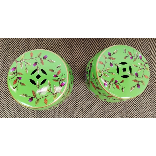 313 - BARREL STOOLS, a pair, green ceramic with floral and bird decoration, 48cm H x 33cm. (2)