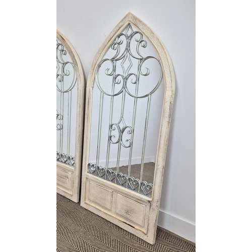 327 - ARCHITECTURAL WALL MIRRORS, a pair, with white arched frames, 140cm H x 67cm. (2)