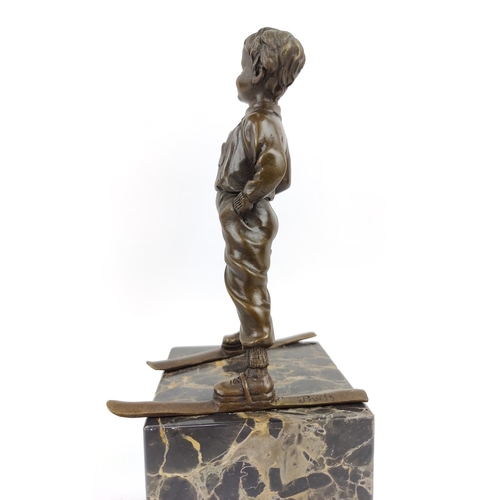 330 - AFTER JOHANN FERDINAND PREISS, of a skier in bronze on a marble base, 39cm H.