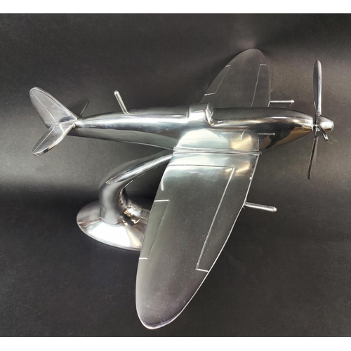 337 - CONTEMPORARY SCHOOL SPITFIRE SCULPTURE, in polished metal, 38cm H x 58cm.