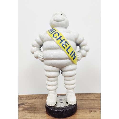 348 - MICHELIN MAN SCULPTURE, painted cast metal, 40cm H.