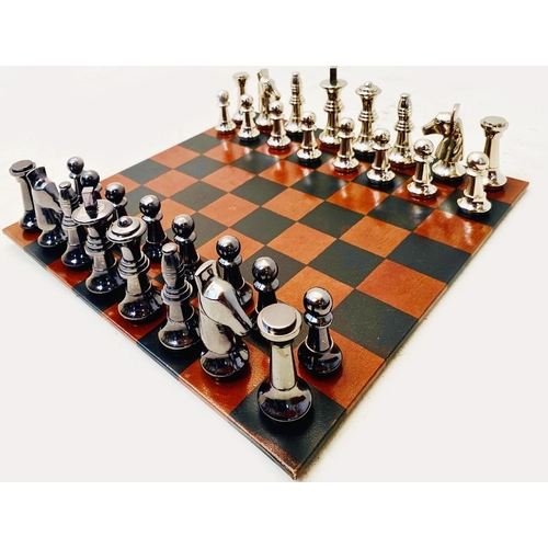 491 - TRAVELLING CHESS SET, in a leather4d case, 30cm x 30cm x 6cm H.