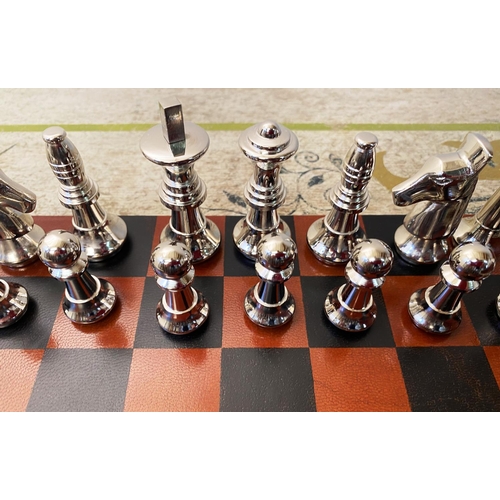 491 - TRAVELLING CHESS SET, in a leather4d case, 30cm x 30cm x 6cm H.