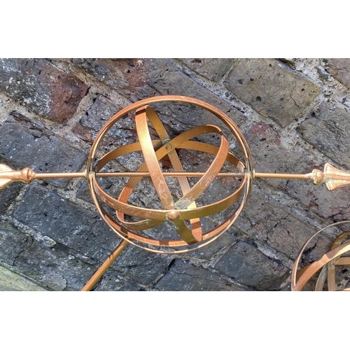 499 - ARMILLARY SHPERE GARDEN STAKES, a set of four, copper coloured metal, 115cm H x 40cm x 17cm. (4)