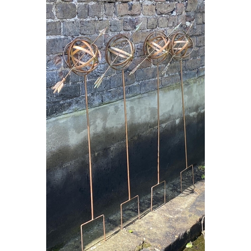 499 - ARMILLARY SHPERE GARDEN STAKES, a set of four, copper coloured metal, 115cm H x 40cm x 17cm. (4)