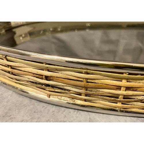 540 - COCKTAIL TRAYS, a pair, oval, polished metal and rattan, 53.5cm x 30cm x 7cm approx.