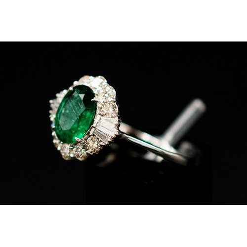 30 - 18CT WHITE GOLD RING SET, with an oval-cut emerald surrounded by a halo of diamonds, emerald 1.38ct,... 